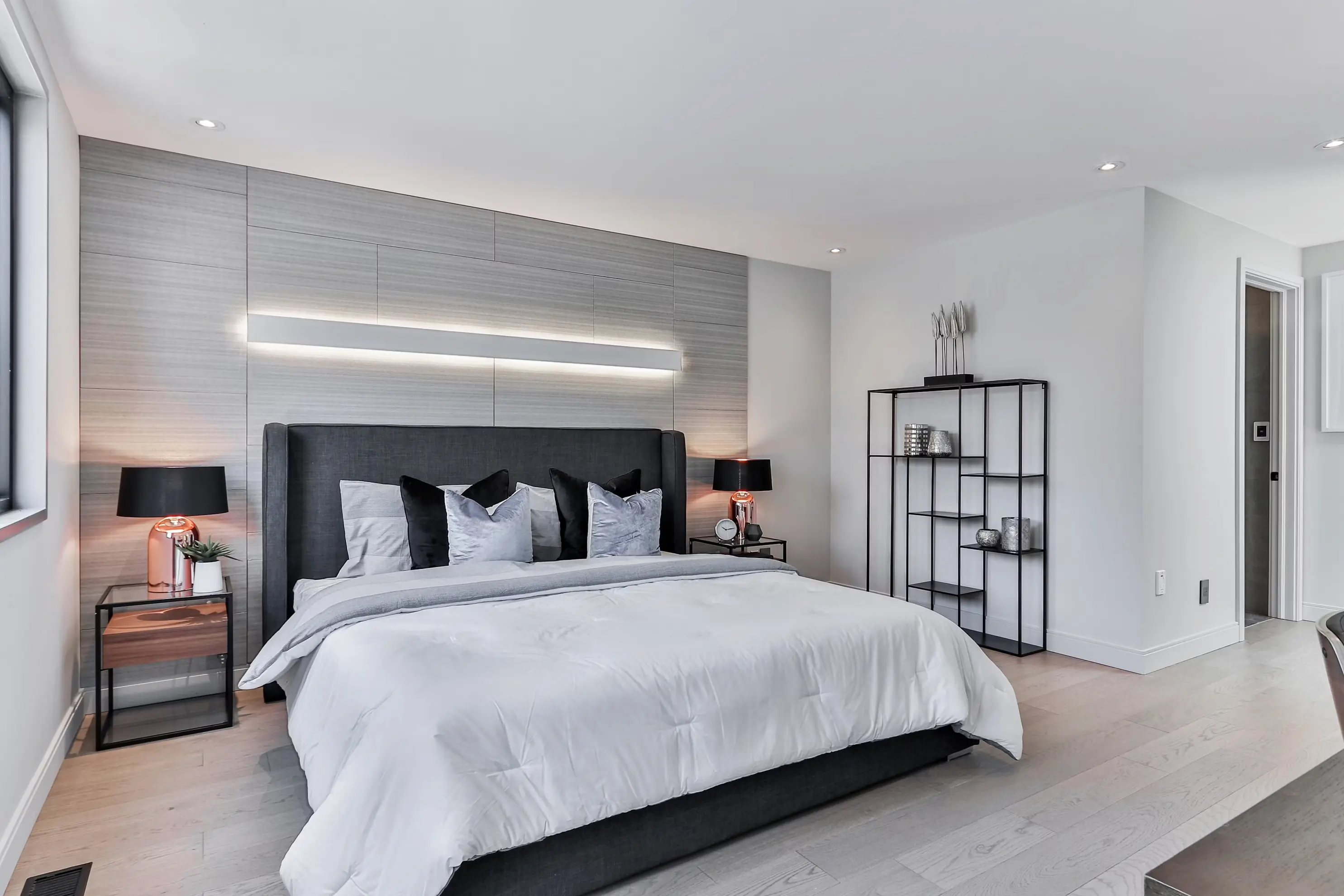 After photo showing the same living room redesigned by AI into a contemporary, minimalist style.